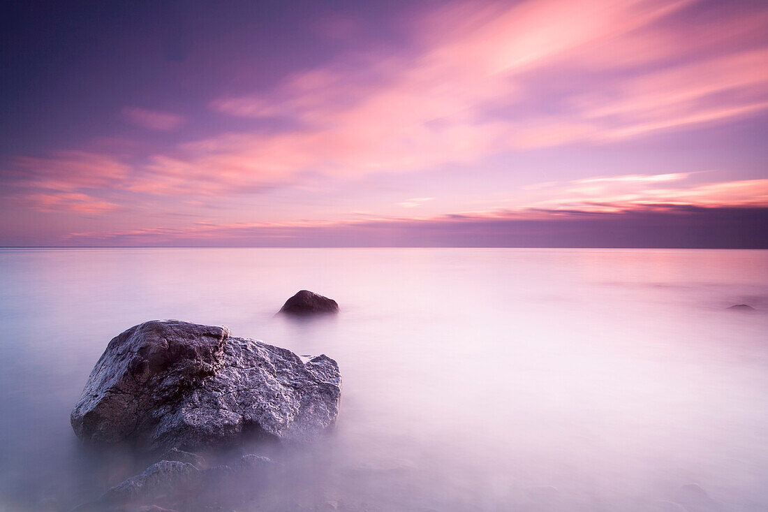 'Long exposure makes the water of Lake Michigan into mist on a cloudy morning; Wisconsin, United States of America'