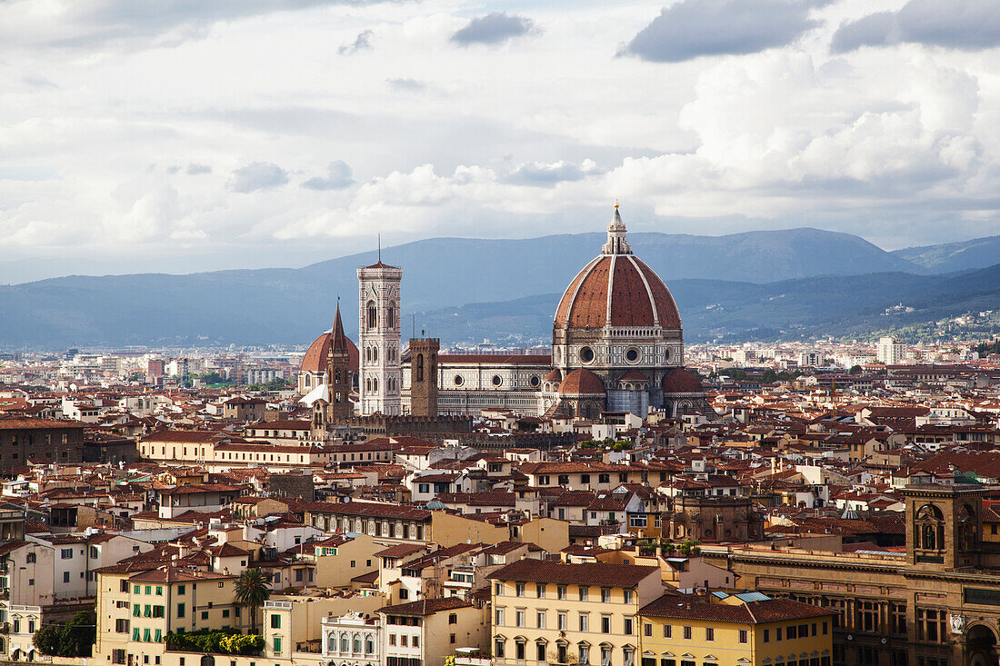 'Cityscape of Florence and Basilica of Saint Mary of the Flower under a cloudy sky; Florence, Tuscany, Italy'