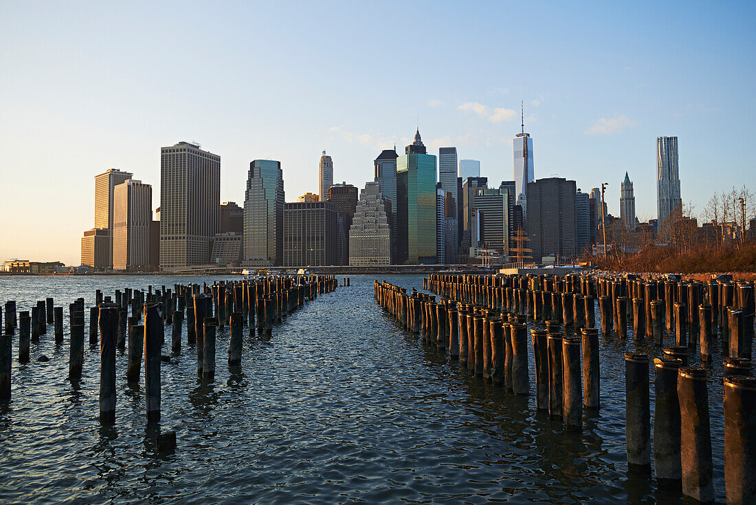 'View of financial district of Manhattan from Brooklyn Bridge Park at sunset; New York City, New York, United States of America'