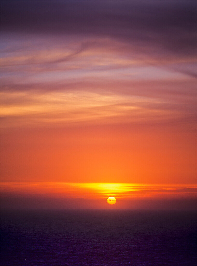 'The sun sets over the Pacific Ocean; Florence, Oregon, United States of America'