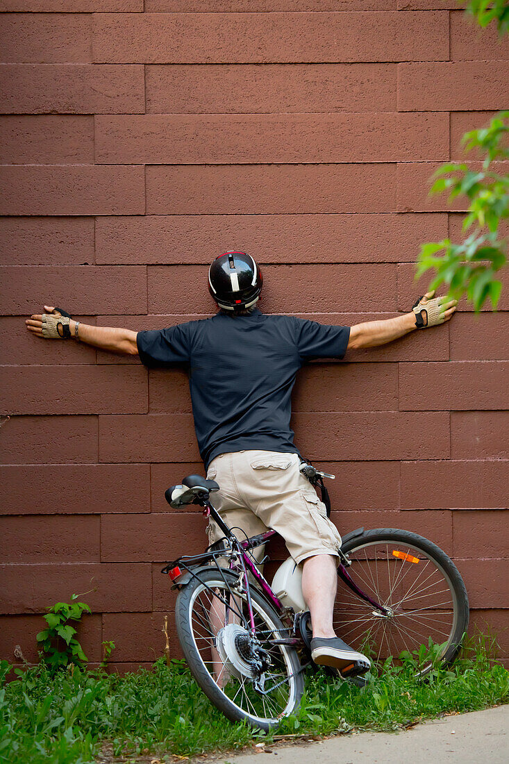 'Cyclist crashing into a wall on a bike path; Edmonton, Alberta, Canada'