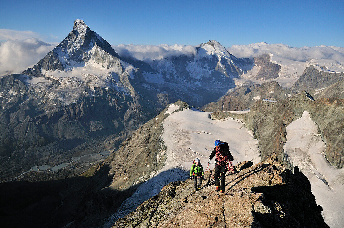 mountaineers on the Arbengrat of Obergabelhorn (4034 m), Matterhorn in the background, Wallis, Switzerland