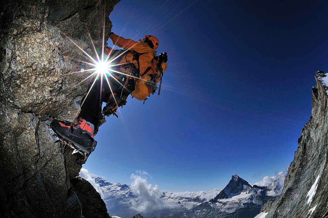 mountaineers on the eastridge of Obergabelhorn (4034 m), crampons on rock,  Wallis, Switzerland