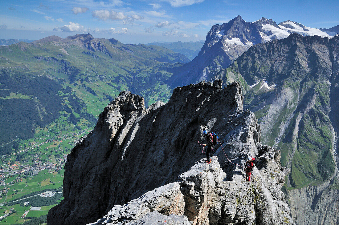 Two mountaineers on the ridge of Ostegg, Eiger (3970 m), Bernese Alps, Switzerland