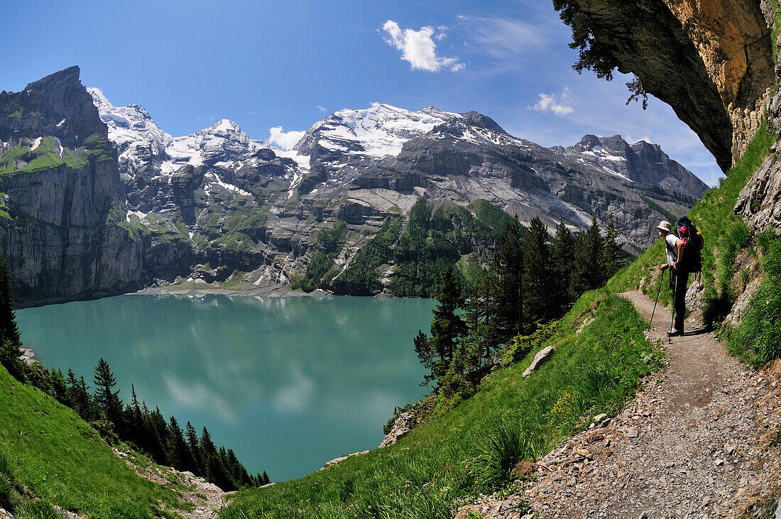 Walker above Oeschinen See, Bernese Alps, Switzerland