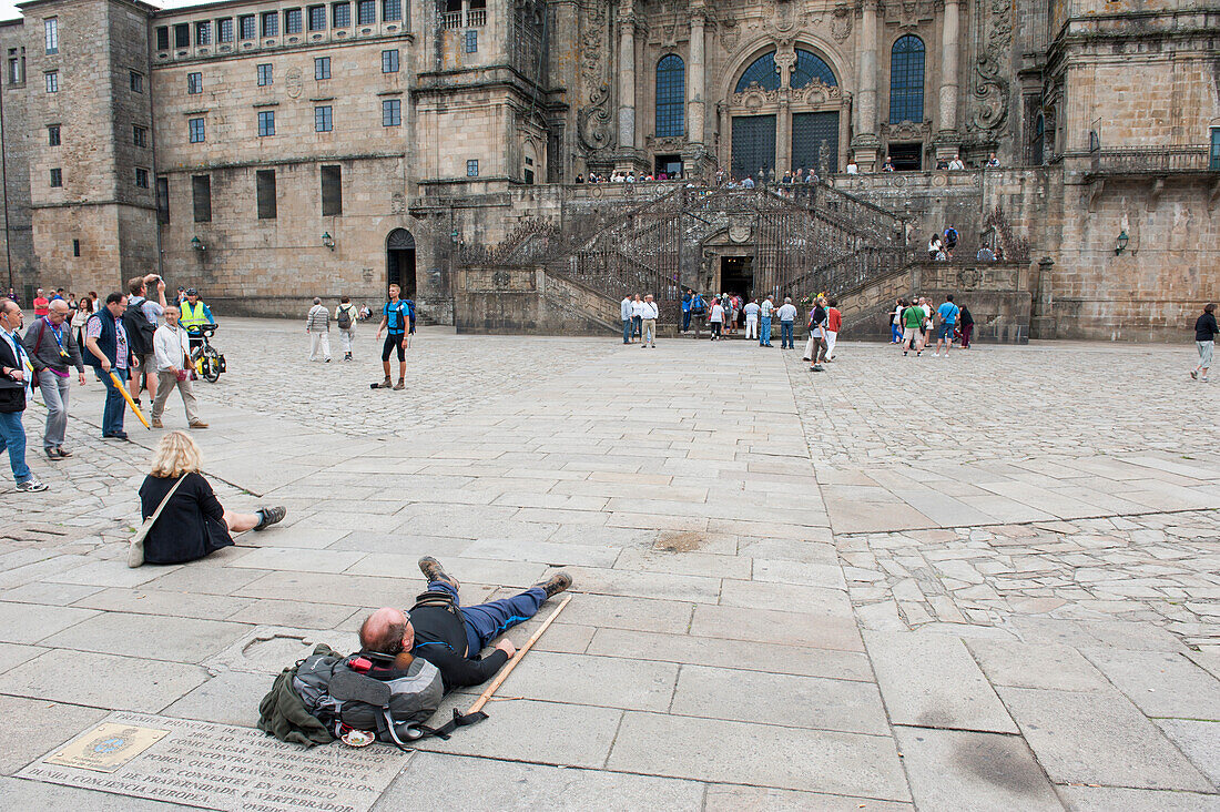 Pilgrims resting in front of Cathedral, Santiago de Compostela, Galicia, Spain
