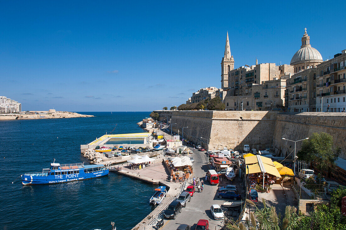 Market stalls and Sliema Ferry in harbor, Valletta, Malta