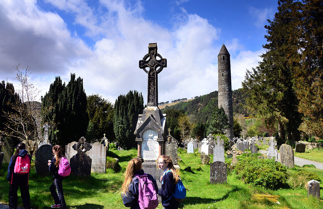 Graveyard with celtic cross, Glendalough in the Wicklow Mountains, South of Dublin, County Wicklow, Ireland