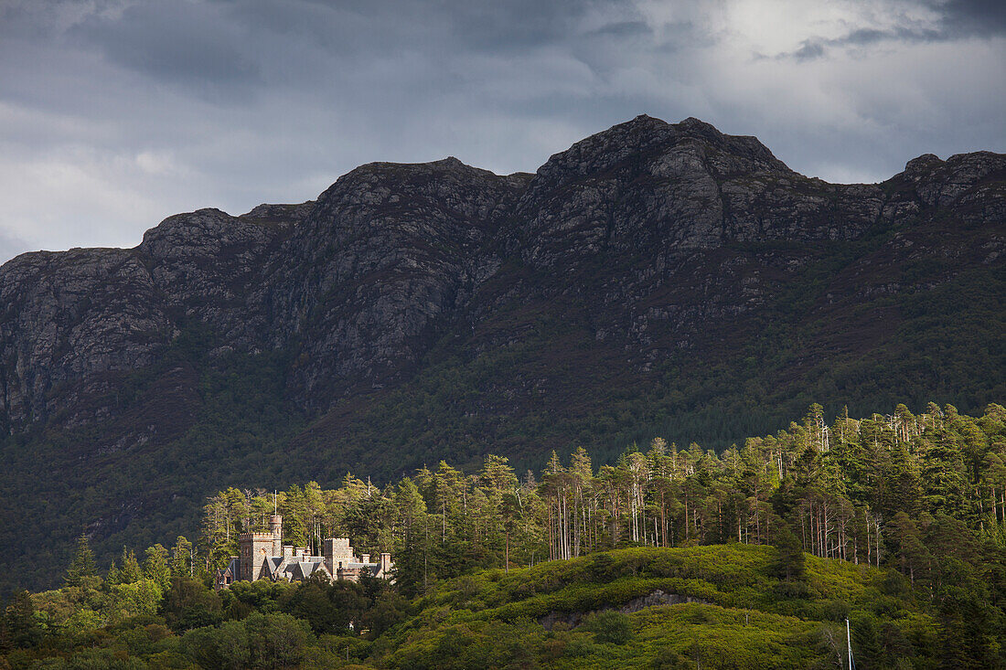 'Castle on a hill on the edge of a forest;Plockton ros-shire scotland'