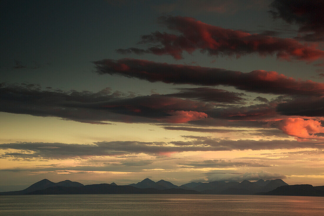 'Dramatic sky at sunset over the ocean;Skye scotland'