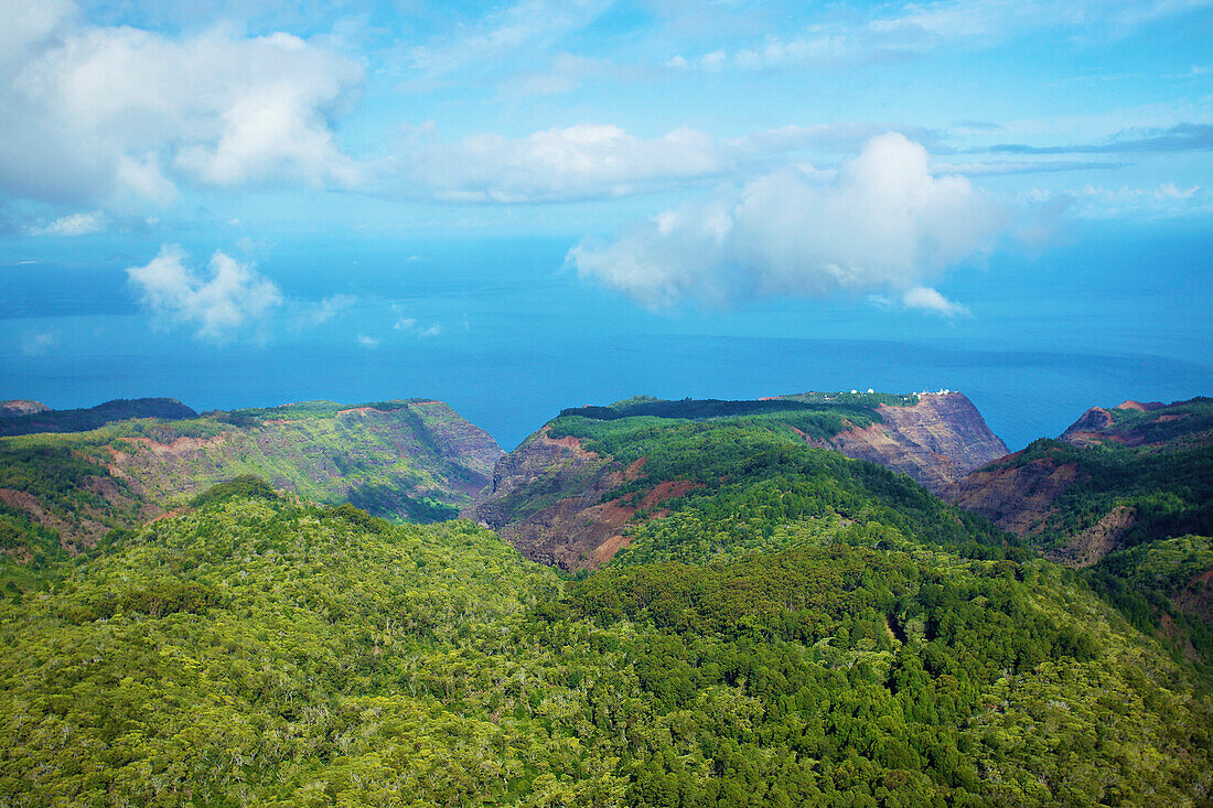 'Rugged landscape of mountains covered with trees under a cloudy sky;Hawaii united states of america'