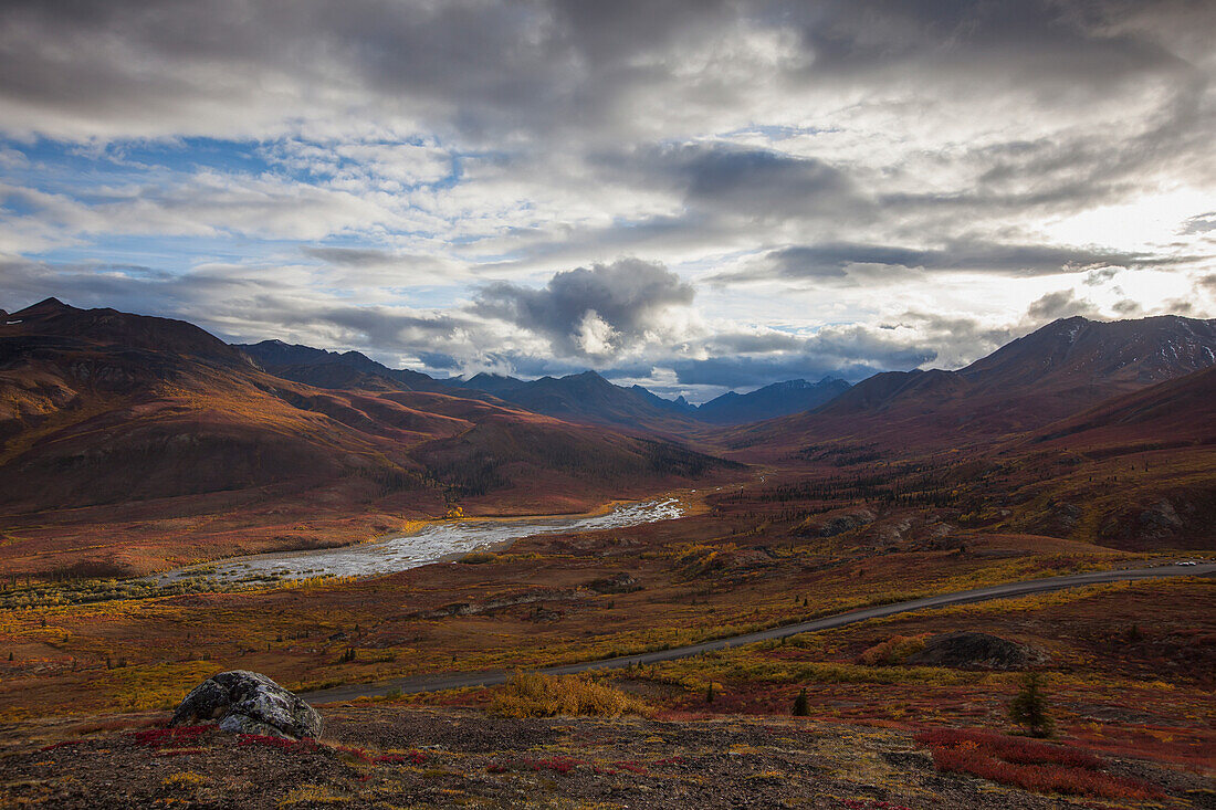'The dempster highway and klondike valley with the tundra covered in autumn colours;Yukon canada'