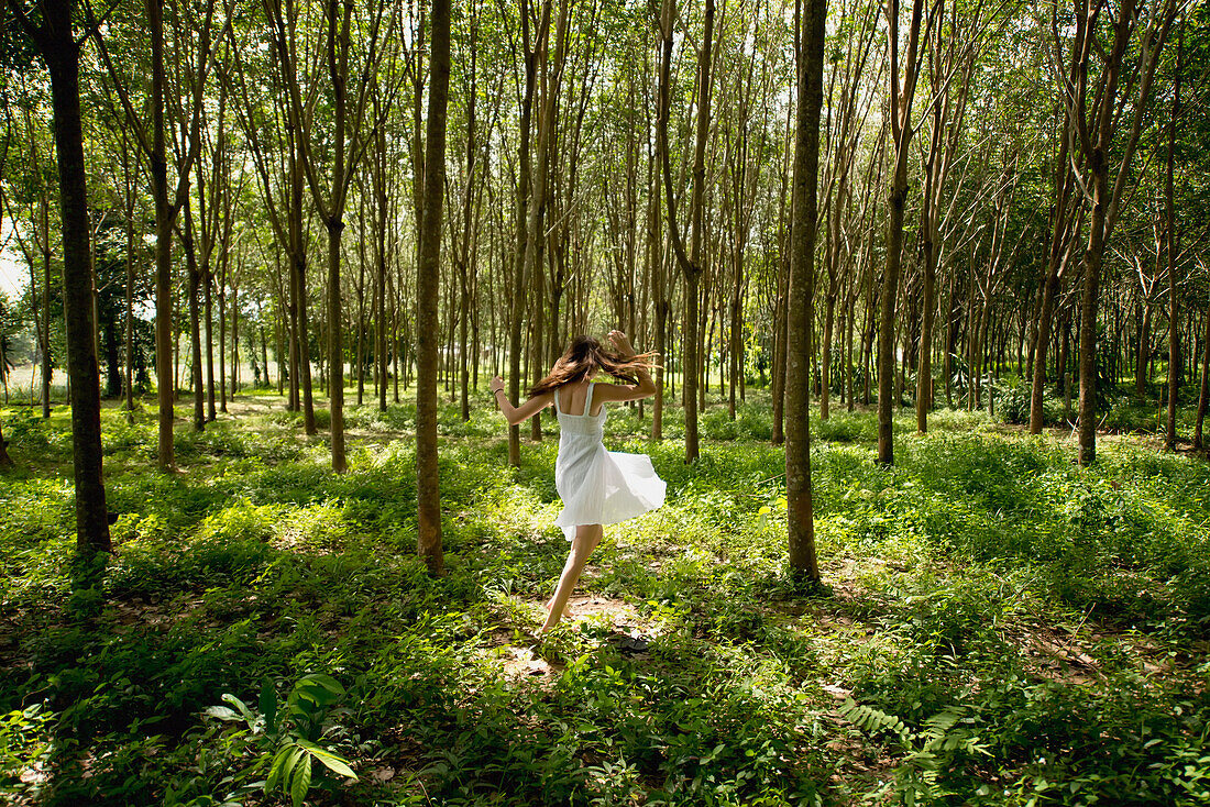 'Girl dancing in the woods;Phuket thailand'