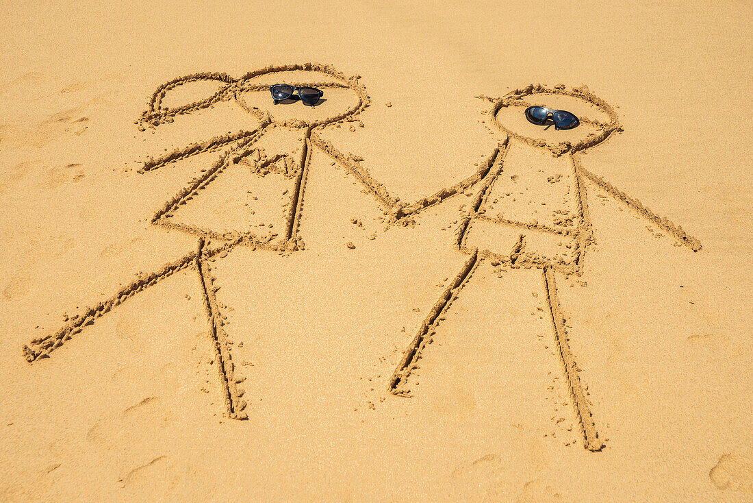 'Drawing of a couple in the sand in praia do bode;Fernando de noronha pernambuco brazil'