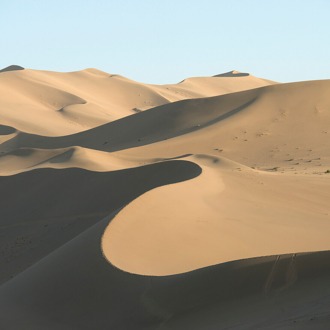 Desert landscape of sand slopes and ridges