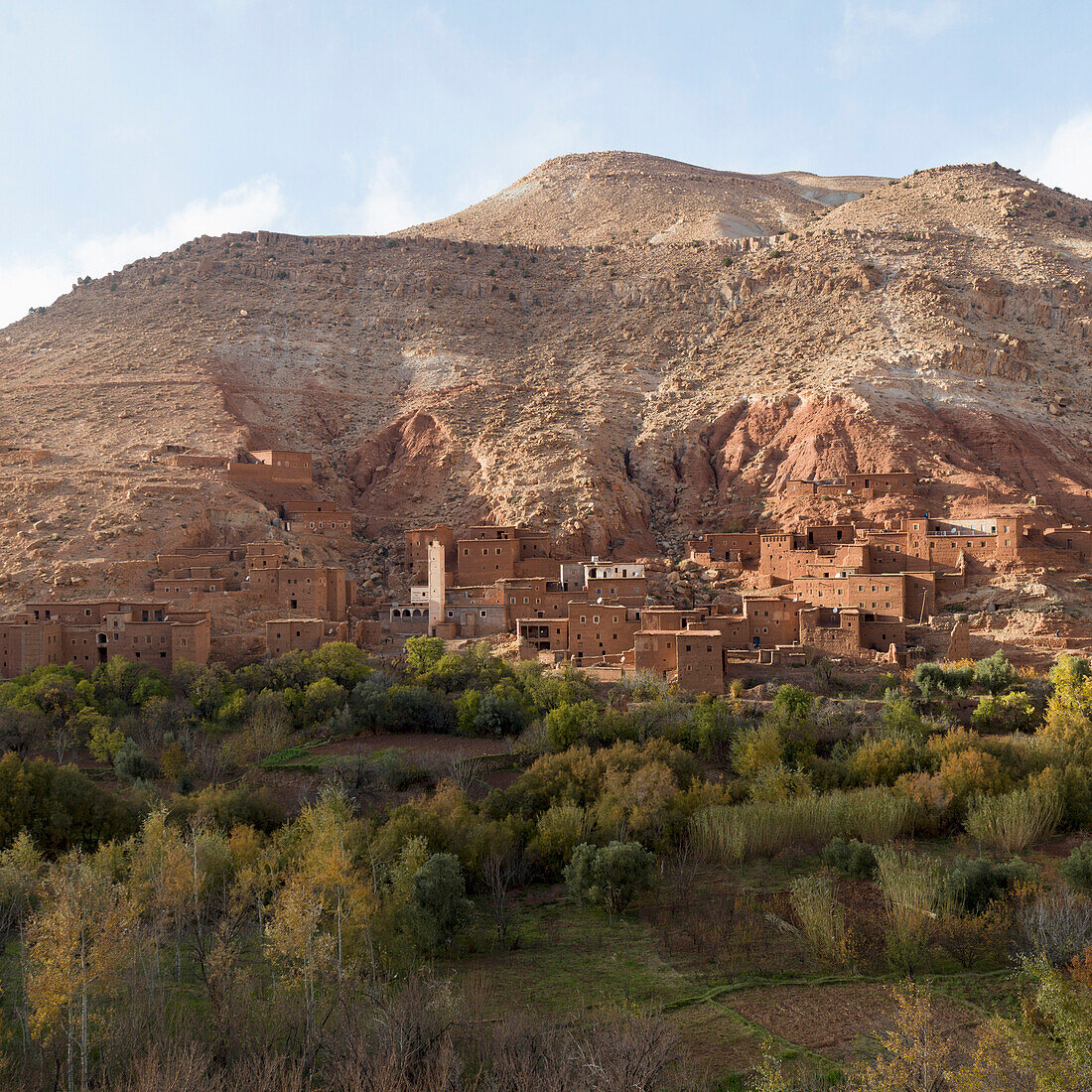 Buildings at the foot of a mountain