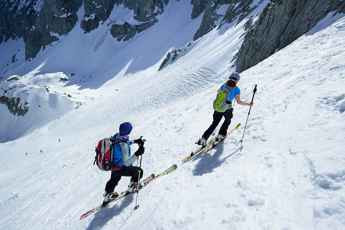 Two back-country skiers ascending towards Griesner Kar, Wilder Kaiser, Kaiser Mountains, Tyrol, Austria