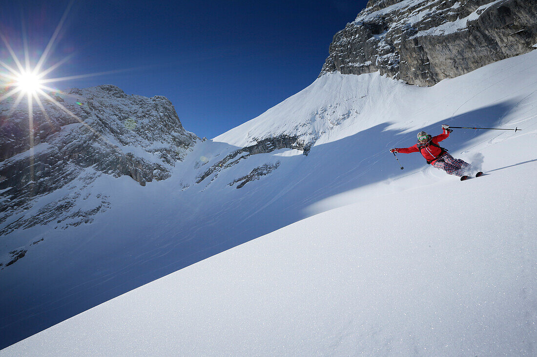 Man downhill skiing from Zugspitze, Upper Bavaria, Germany