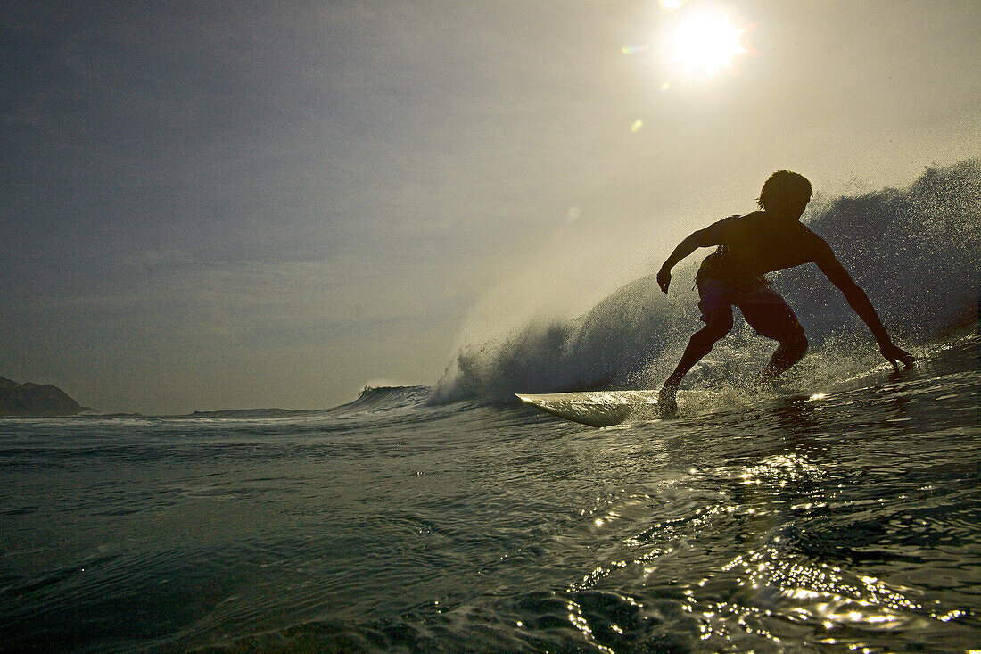 Surfer riding a wave, Praia, Santiago, Cape Verde