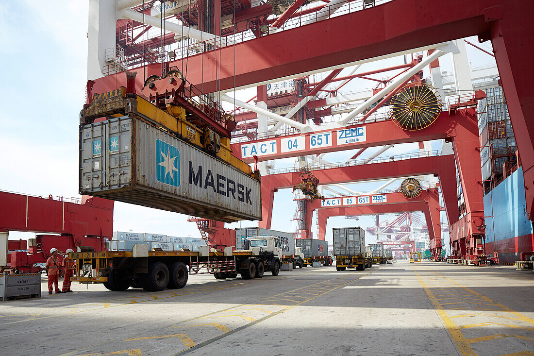 Loading of a container on a truck at harbor, Port of Tianjin, Tianjin, China