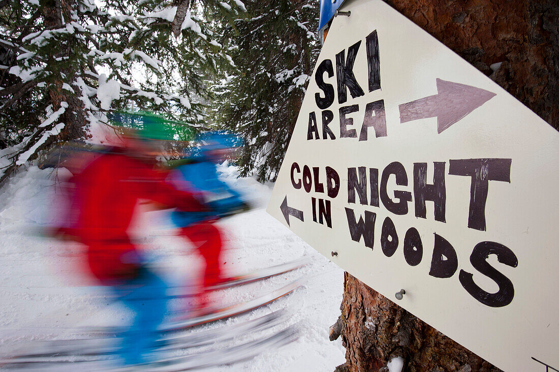 Warning sign beside ski slope, Vail, Colorado, USA