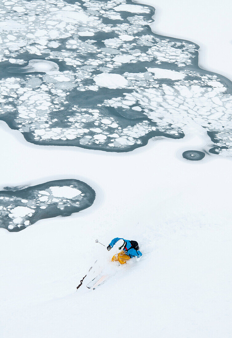 Skier passing a frozen lake, Portillo, Valparaiso Region, Chile