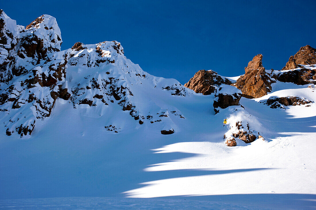 Skier in mid-air, Diavolezza, Engadin, Canton of Graubuenden, Switzerland