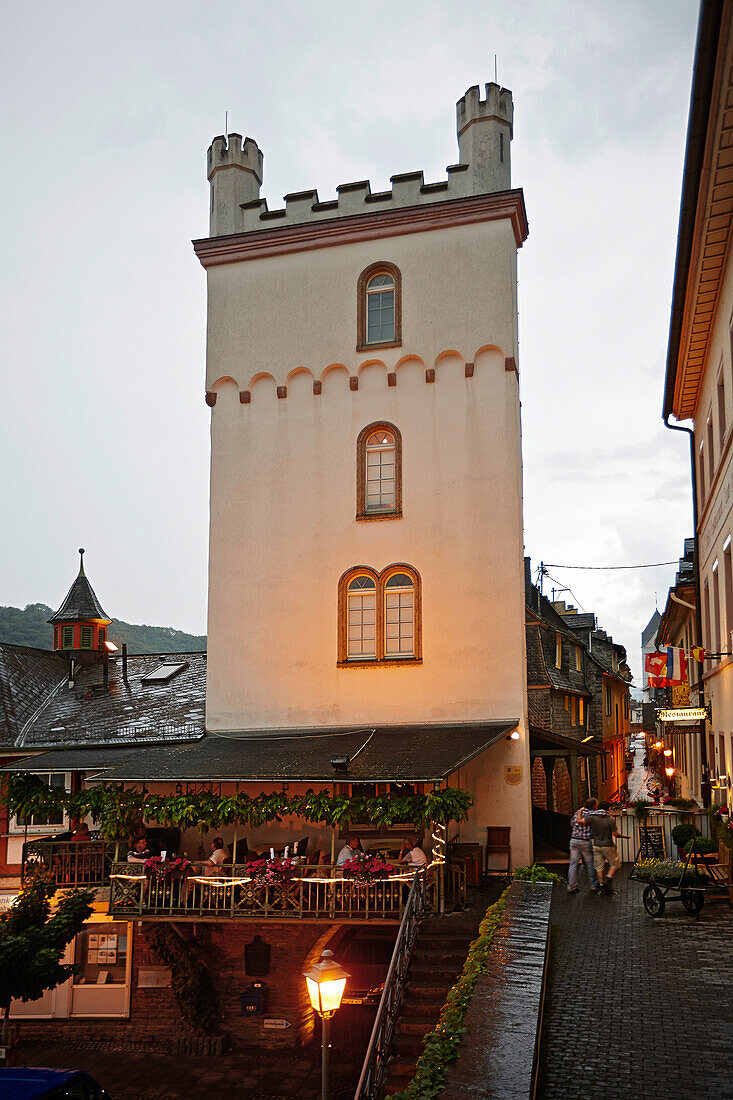 Guests on terrace of a hotel in the evening, Kaub, Rhineland-Palatinate, Germany