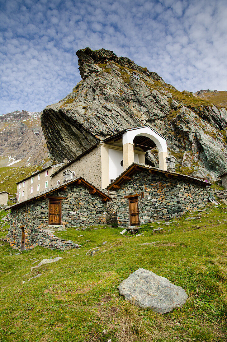 An alpine sanctuary, under a big rock, Sanctuary of San Besso, Soana Valley, Piedmont, Gran Paradiso National Park