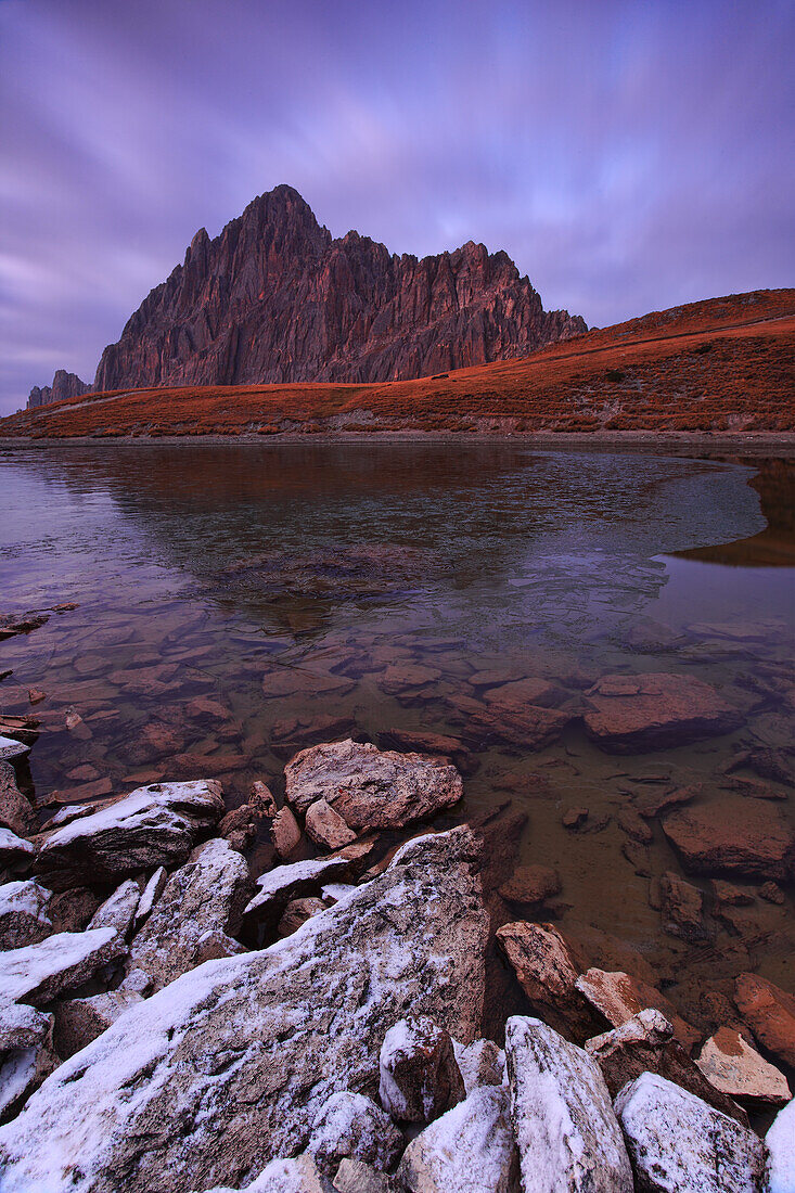 Rocca la Meia and its lake in Maira Valley, during a fall evening.