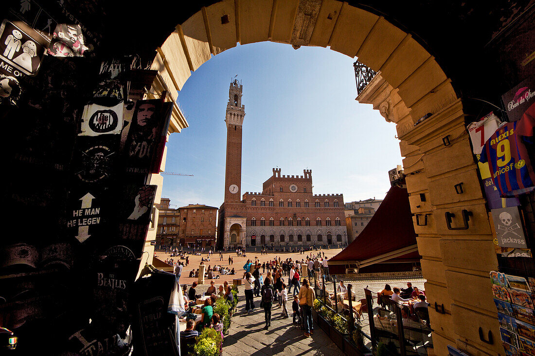 Piazza del Campo in Siena, a view from the small entrance opposite the magnificent Town Hall and Torre del Mangia