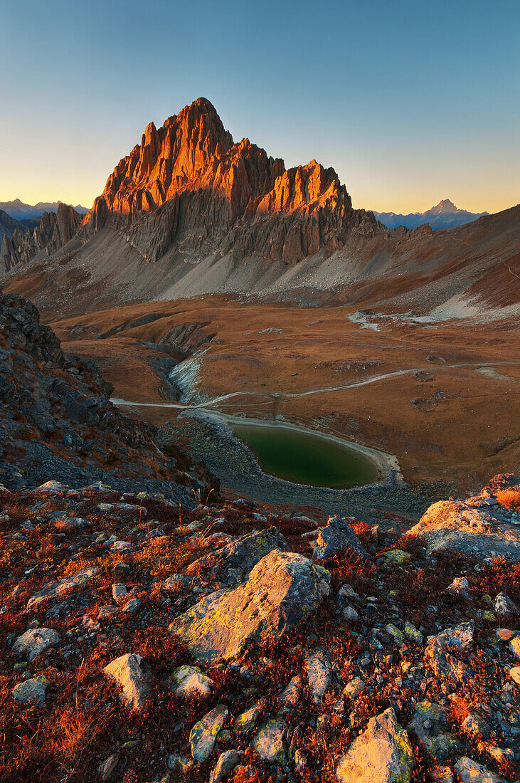 Sunset in mountain's landscape, with Rocca la Meja peak, and an alpine's lake, Maira valley, Piedmont