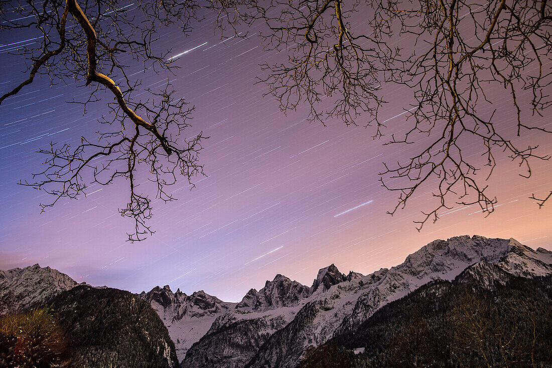 Star trail in the sky over Pizzo Badile and Pizzo Cengalo, two famous peaks in val Bondasca, a lateral of Val Bregaglia, Switzerland