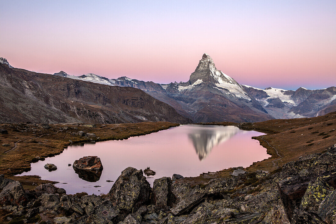 The big Matterhorn's reflection in the Lake Stallisee at sunrise, Zermatt valley, Valais-Wallis Canton, Switzerland