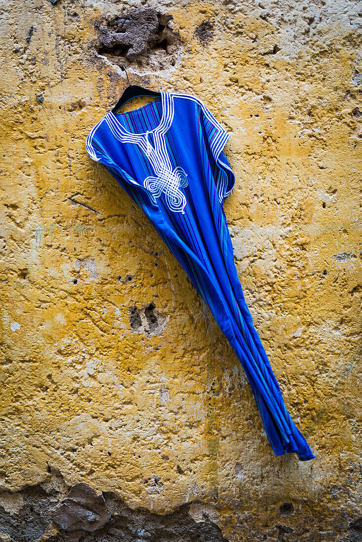 Detail of Arabic blue dress in the medina of Fes, Marocco.