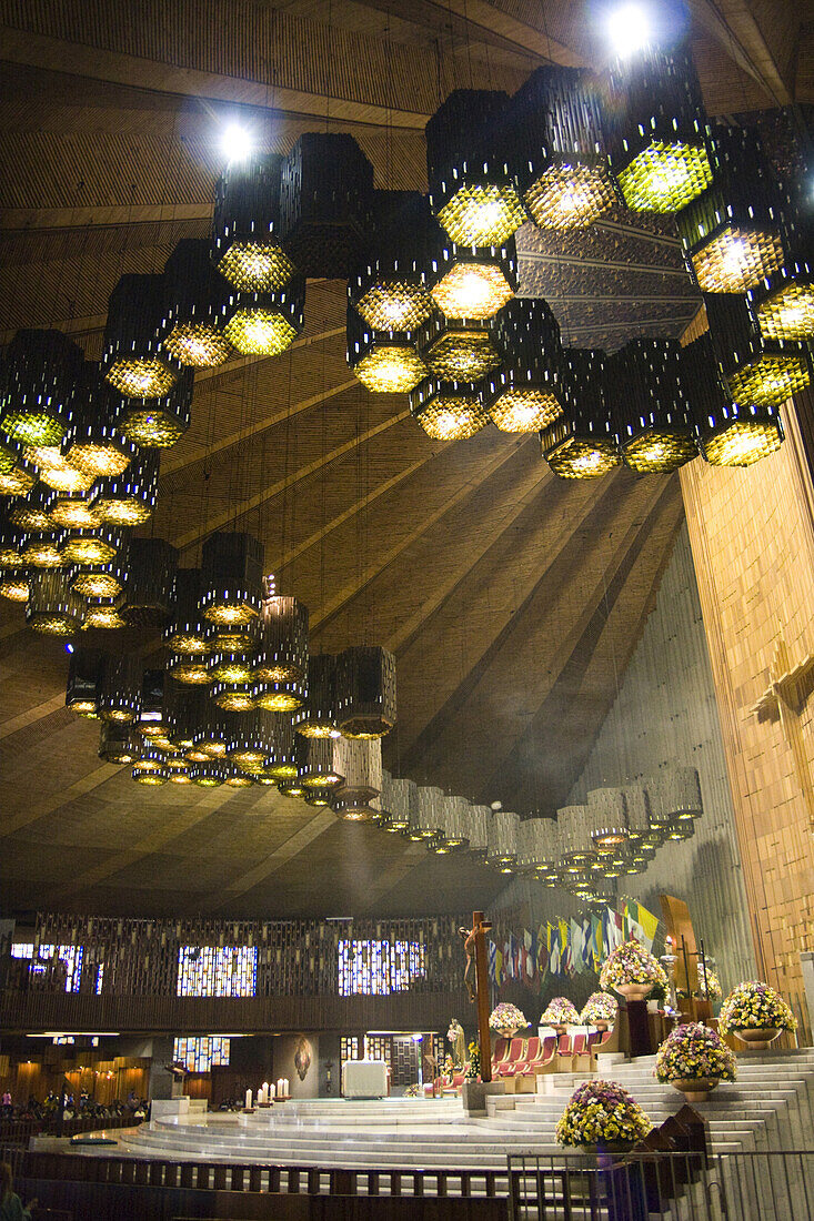 Ceiling lights illuminate the altar in the interior of the modern Basilica of the Virgen de Guadalupe in Mexico City, Mexico on June 11, 2008. Built on Tepeyac hill, where it is said the Virgin appeared to Juan Diego Cuauhtlatoatzin in 1531, the new Basil