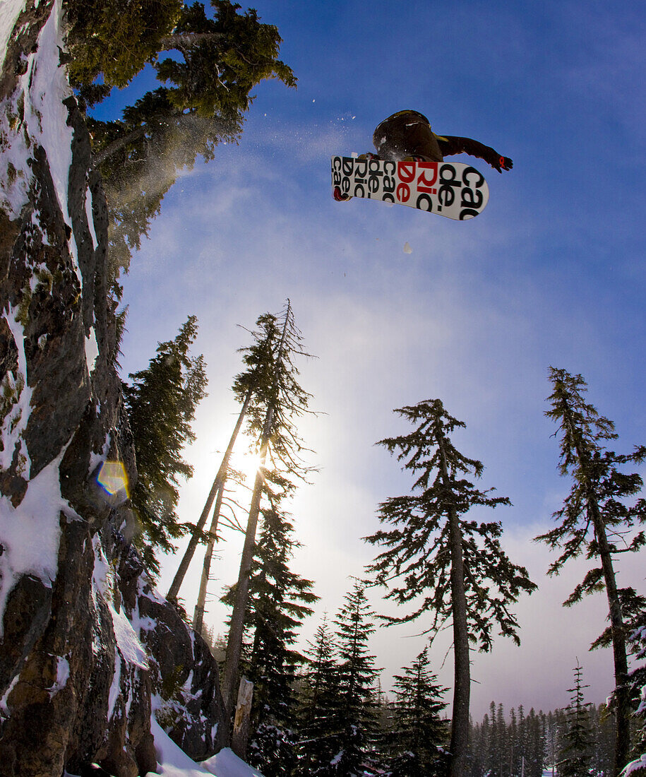 Snowboarder drops in on Yellow Rock - Mt Hood Meadows, OR.