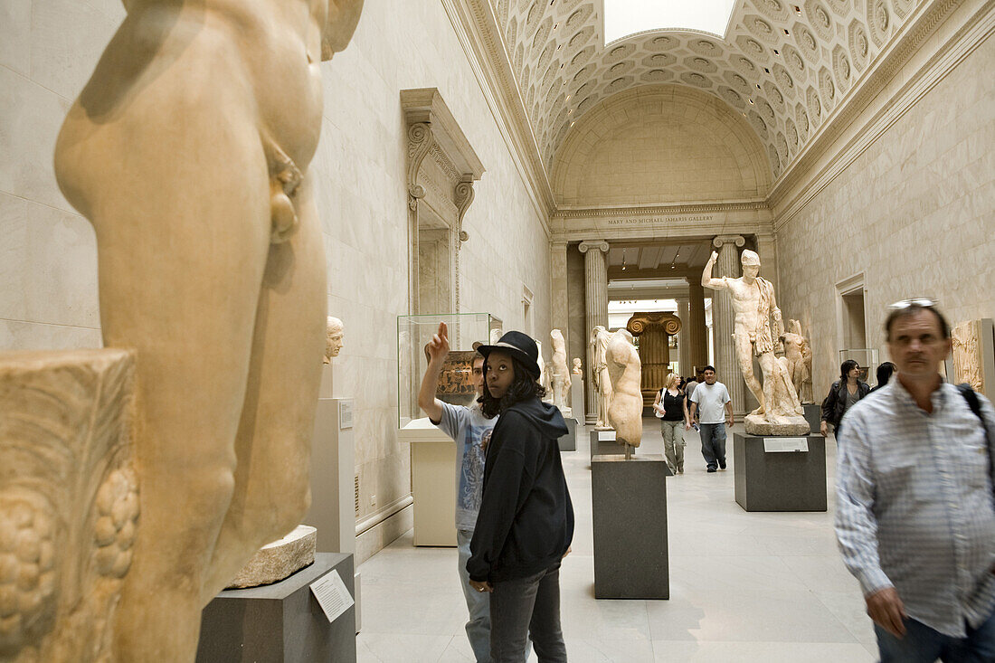 Tourists enjoy looking at the collection of Greek and Roman art at the Metropolitan Museum of Art.   New York City, NY, May 13, 2008