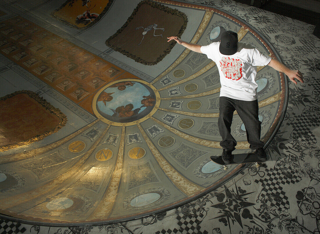 Skateboarder on Ramp with Painted Ceiling Design