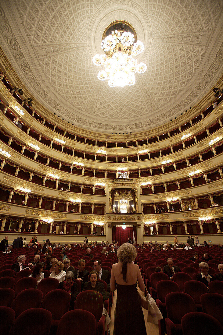 The world-famous La Scala opera house in Milan fills with visitors who came to watch an opera.