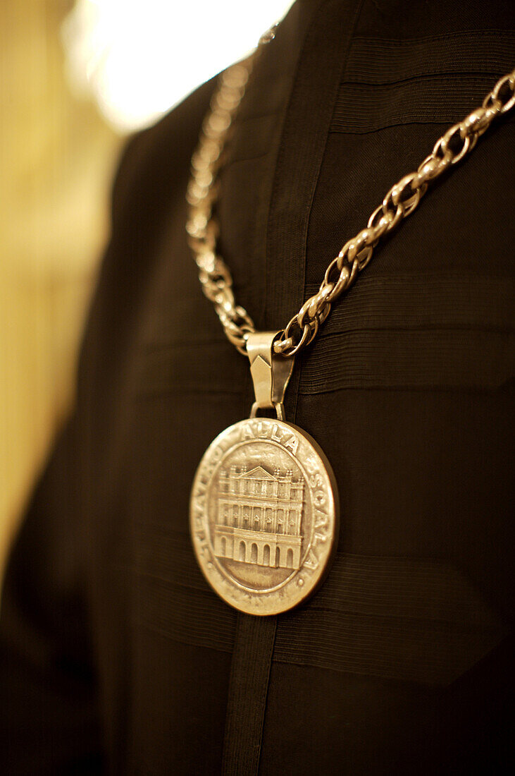 A medallion on the uniform of an usher at the world famous La Scala opera house in Milan, Italy.