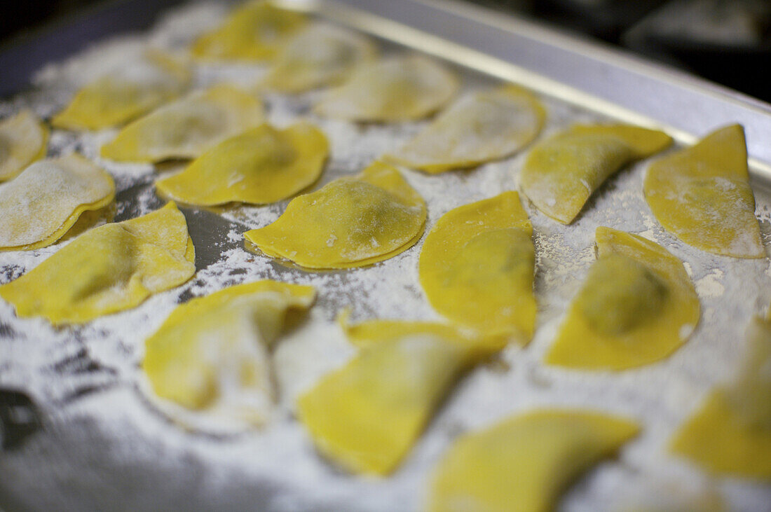 Spinach and caprino cheese ravioli are prepared at the Osteria Vecio Fritolin in Venice.