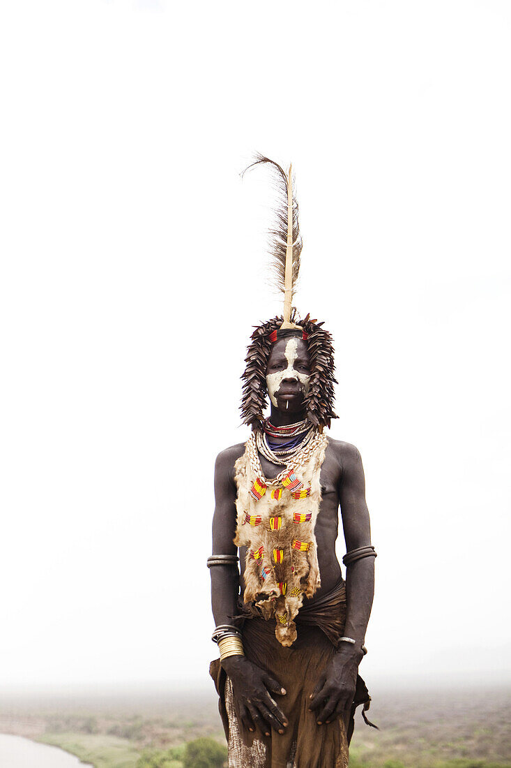 KARO VILLAGE, OMO VALLEY, ETHIOPIA. A portrait of a young boy dressed in the traditional clothes and decoration in the Omo Valley, Ethiopia.