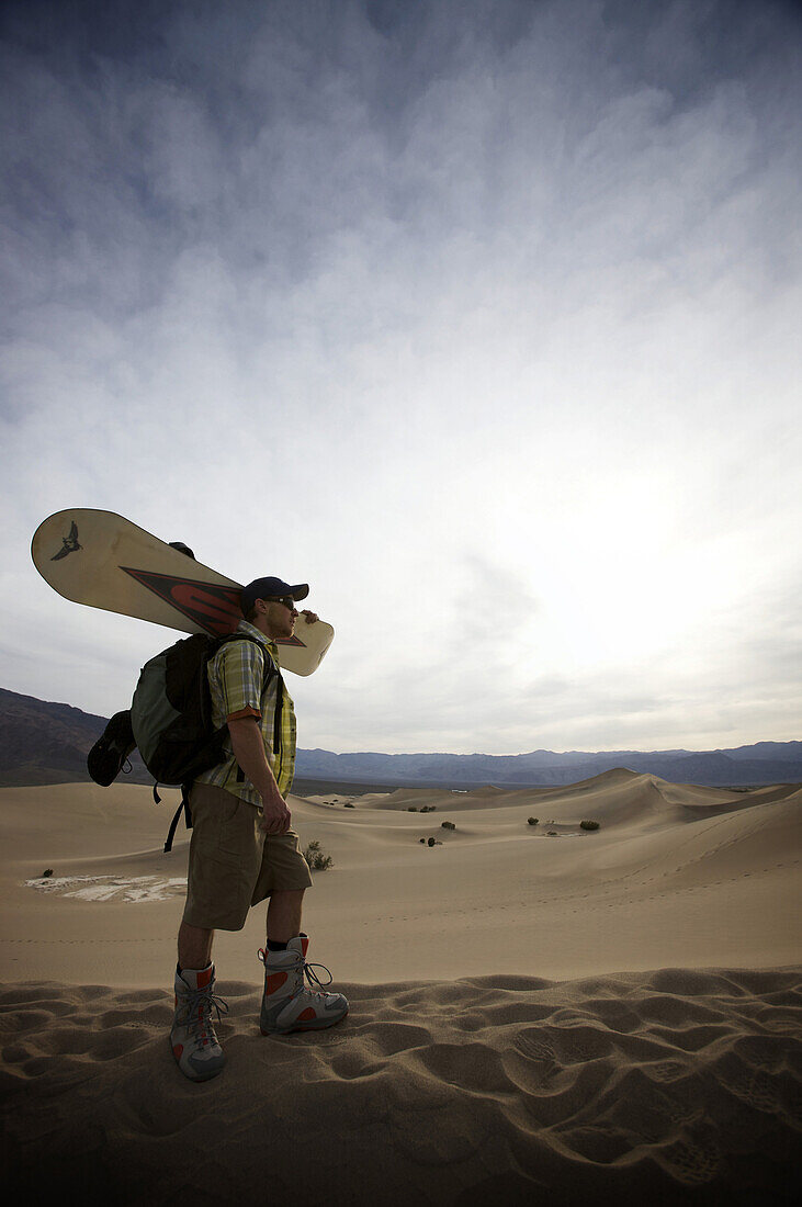 Lone sand boarder heads out to the dunes.