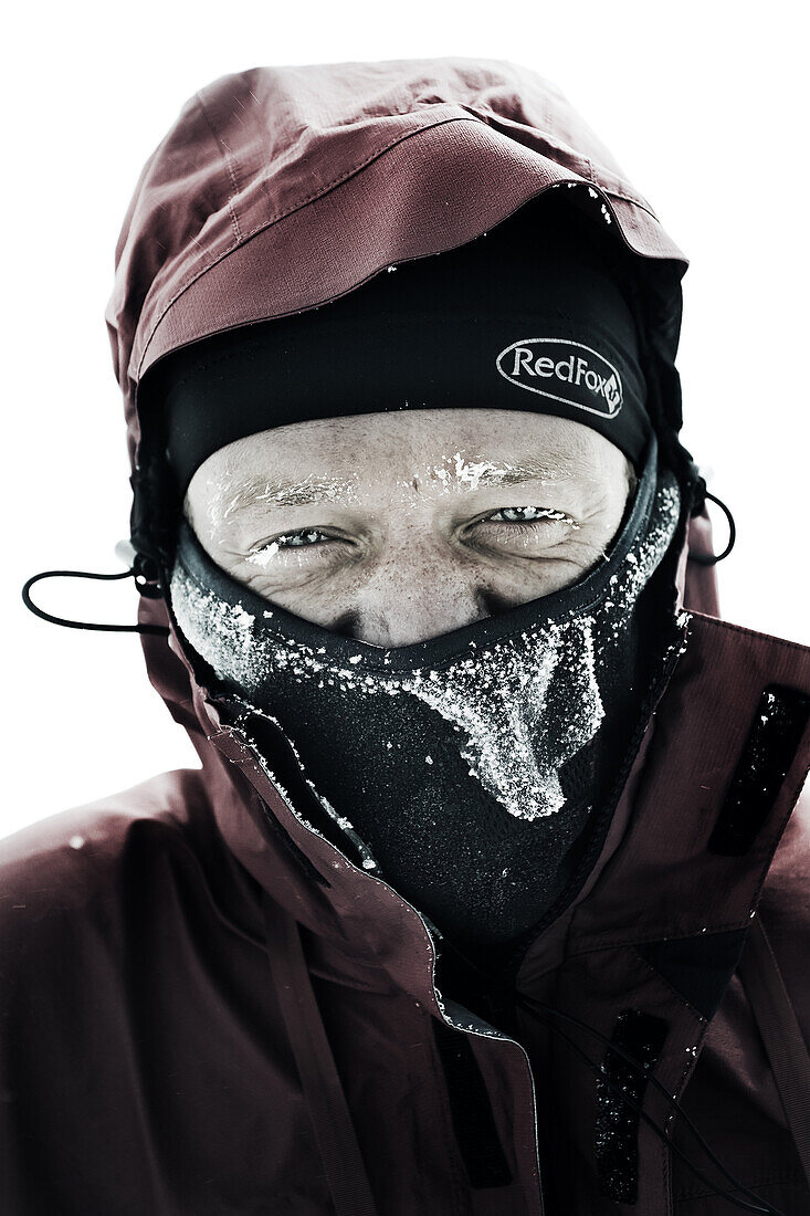 Portrait of a runner with his face covered by the snow and ice during the Elbrus Race in Russia.