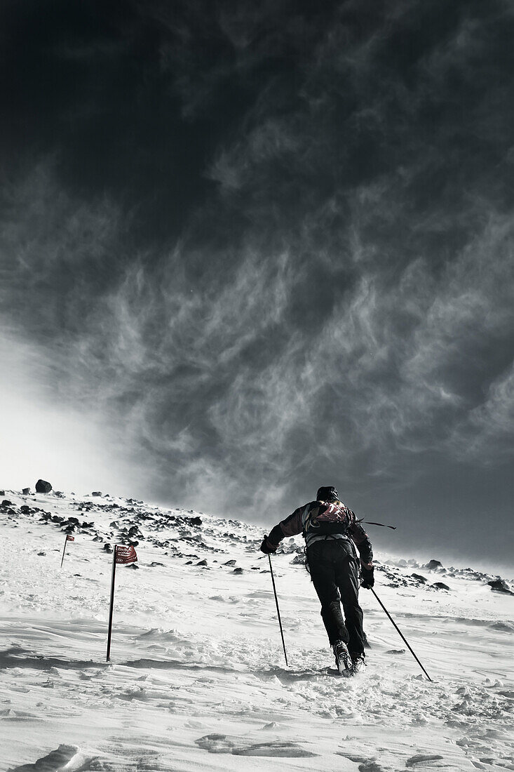 A man walking on Elbrus Mountain during Elbrus Race, the highest race in Europe.