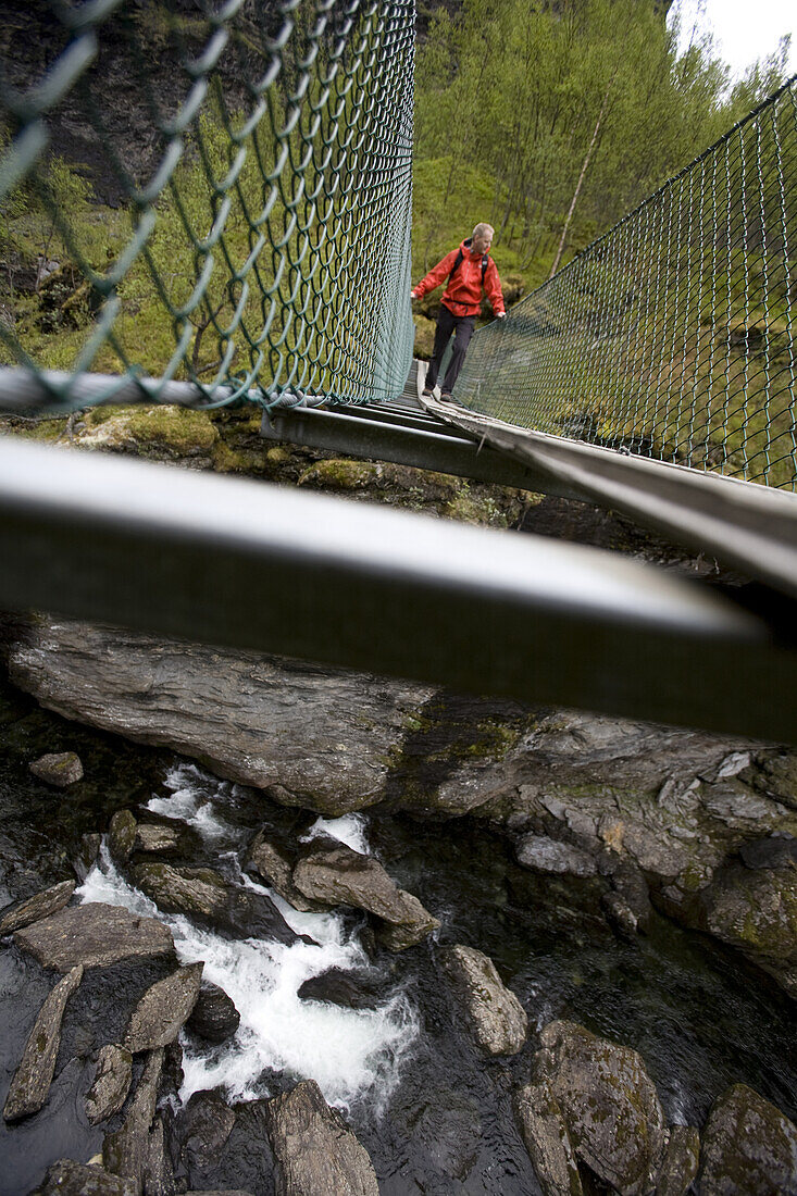Paul Romer, on a suspension bridge while hiking the Aurland Valley from Osterbo to Vassbygdi in Norway.
