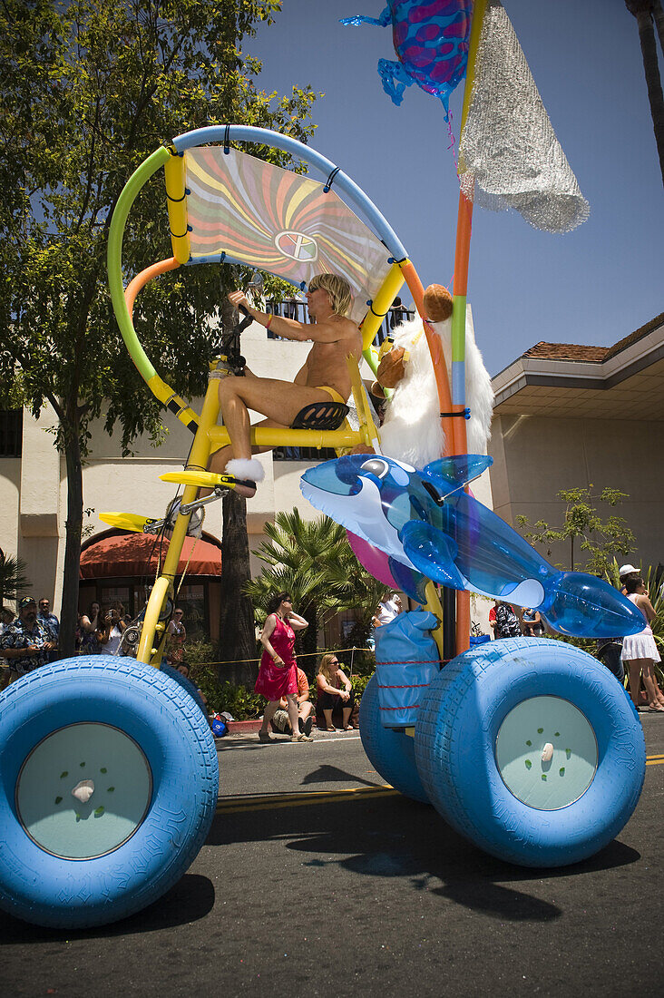 A man in swim fins pedals a unique bicycle at the Solstice Parade on Saturday June 20, 2009.  The annual Summer Solstice Parade in Santa Barbara, California, features extravagant floats, whimsical costumes and creative dancing ensembles. From its beginnin