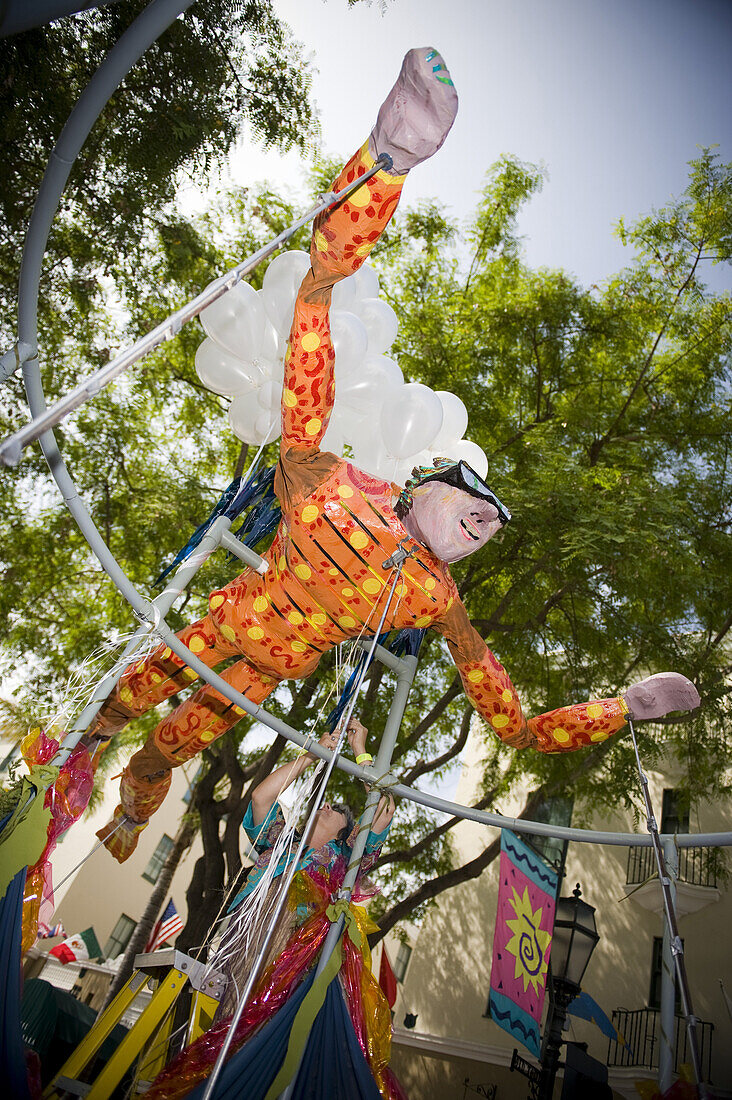 Diane Arnold puts the finishing touches on the Flying Man float at the Solstice Parade on Saturday June 20, 2009.  The annual Summer Solstice Parade in Santa Barbara, California, features extravagant floats, whimsical costumes and creative dancing ensembl