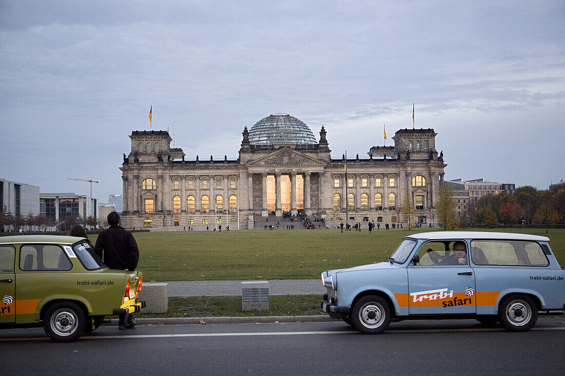 Trabi Safari at the Reichstag parliament building  A popular tourist attraction offers Berlin visitors the chance to drive original East German Trabant cars, one of two car models built in the GDR.  Berlin, October 2008
